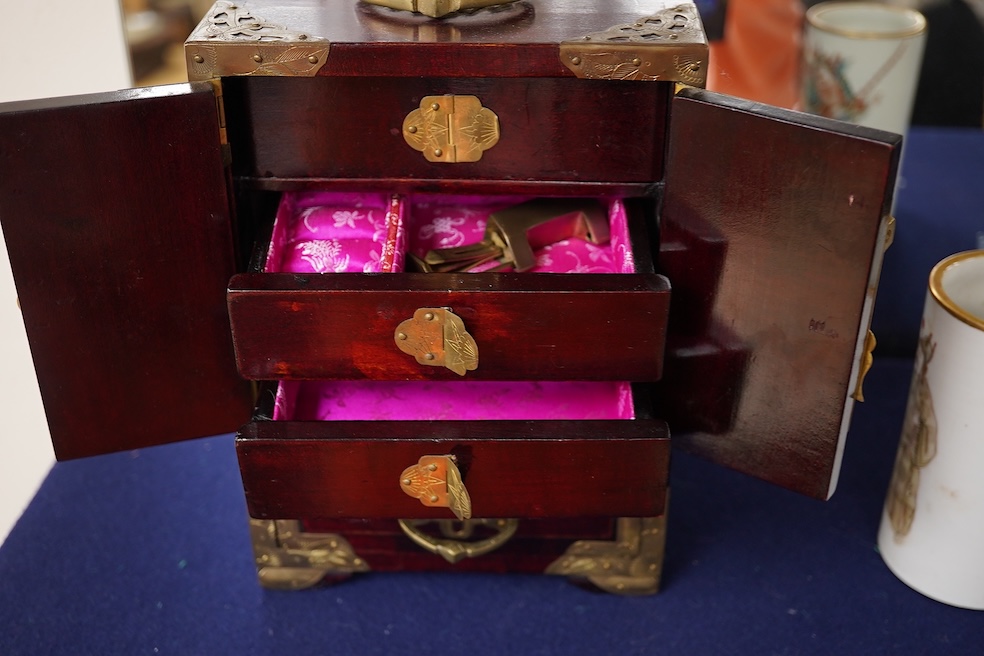 A Chinese brass mounted jewellery cabinet, decorated with enamel plaques. 21cm high. Condition - generally good